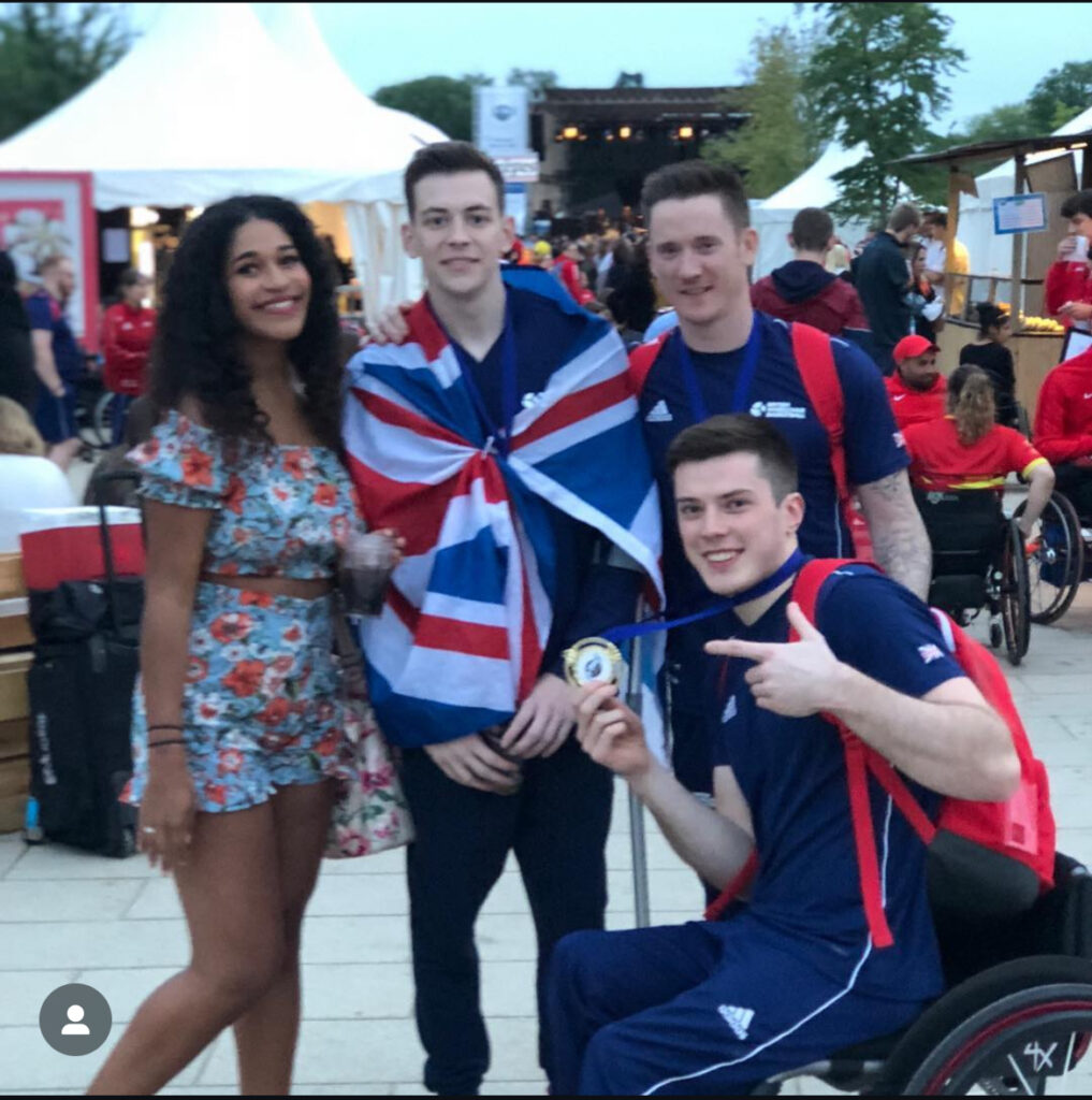 the author Dani stood with Paralympic Wheelchair basketball players George Bates, Terry Bywater and Phil Pratt at the wheelchair basketball world championships in 2018.