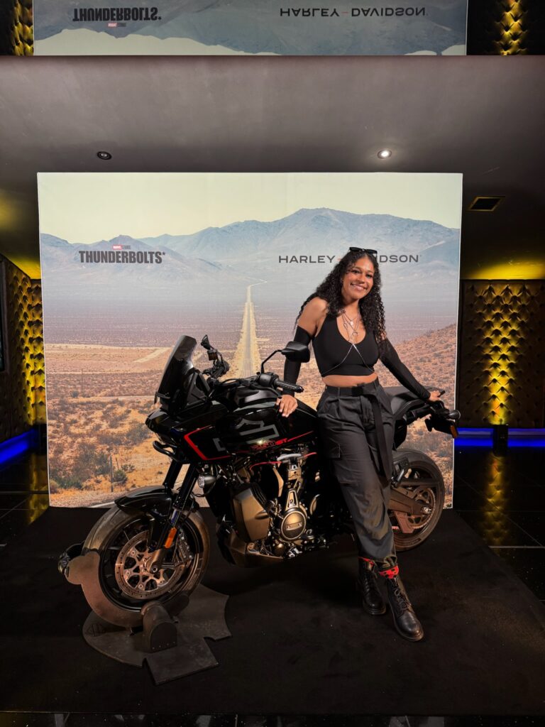 Dani posing in front of the bike featured in thunderbolts.
